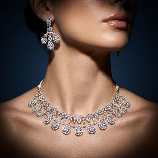 Diamond necklace and earrings on a model against a dark background