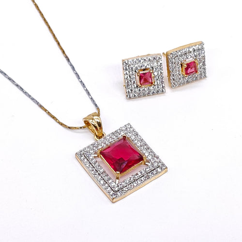 Dual-tone ruby red square American diamond pendant set with matching earrings in silver and gold plating