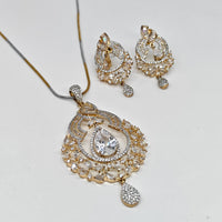 Gold and silver jewelry set with necklace and earrings on a white background