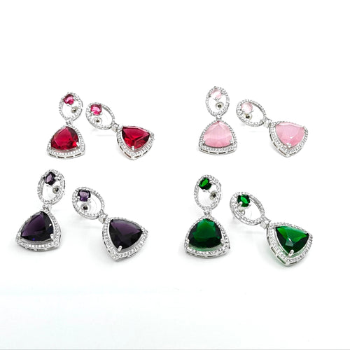 Set of colorful gemstone earrings on a white background