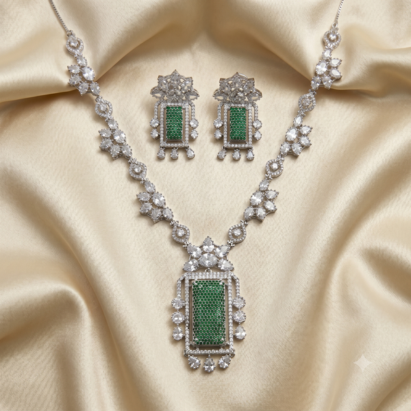 Jewelry set with necklace and earrings on a beige fabric background