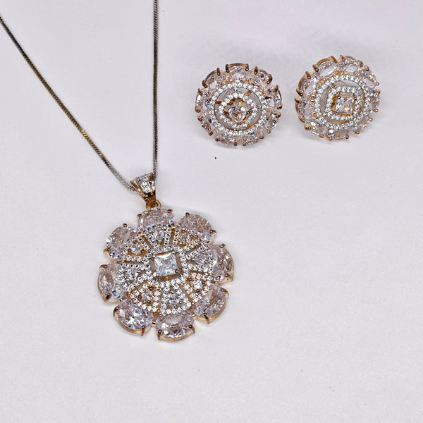 Gold-plated American diamond pendant set with matching stud earrings and floral design