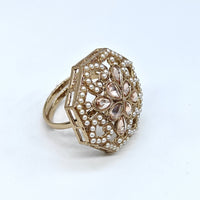Decorative ring with intricate design on a white background