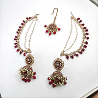 Jewelry set with necklaces and earrings on a white background
