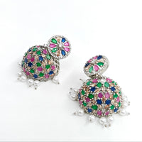 Multicolored gemstone earrings with pearl accents on a white background