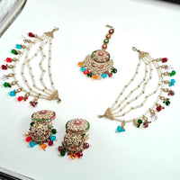 Decorative jewelry set with necklaces and earrings on a white surface