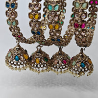 Decorative necklace with colorful gemstones on a light gray background