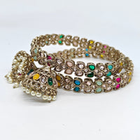 Set of colorful beaded bracelets on a white background