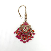 Decorative keychain with pink and orange beads on a white background