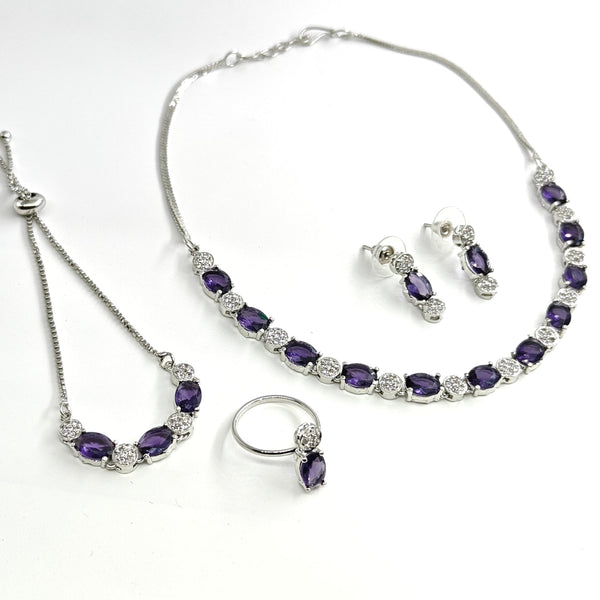 Jewelry set with necklace, bracelet, and earrings on a white background
