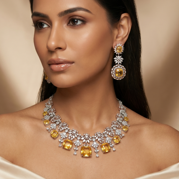 Woman wearing a luxurious diamond and yellow gemstone necklace and earrings against a beige background