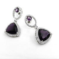 Pair of earrings with purple heart-shaped stones on a white background