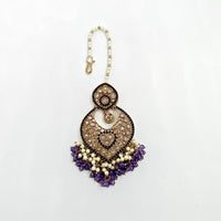 Decorative earring with purple and gold elements on a white background