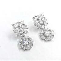 Pair of diamond earrings on a white background