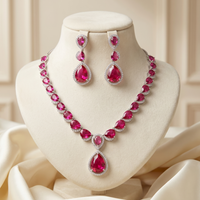 Jewelry set with red gemstones on a mannequin bust