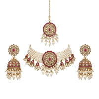 Ornate necklace with matching earrings on a white background