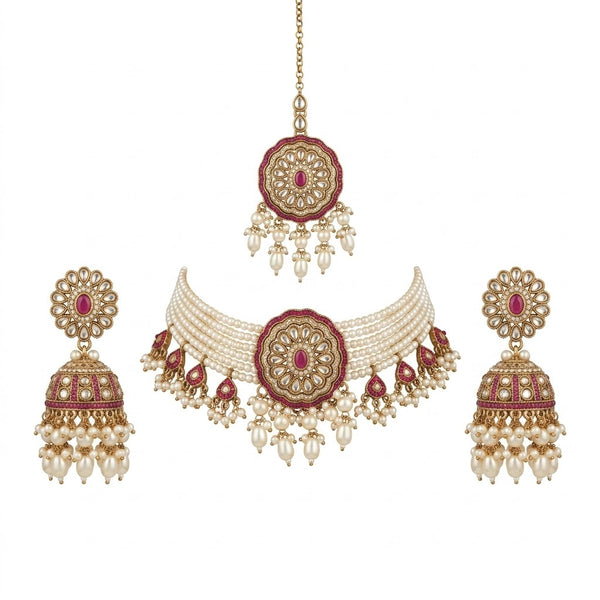 Ornate necklace with matching earrings on a white background