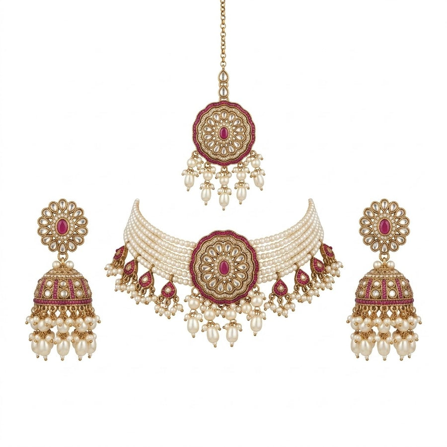 Ornate necklace with matching earrings on a white background