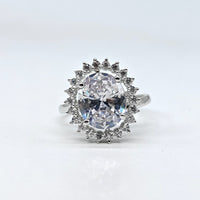 Silver-plated crystal halo adjustable ring with oval center stone and sparkling American diamond accents for women