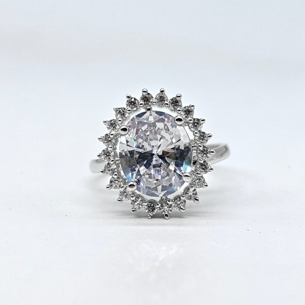 Silver-plated crystal halo adjustable ring with oval center stone and sparkling American diamond accents for women