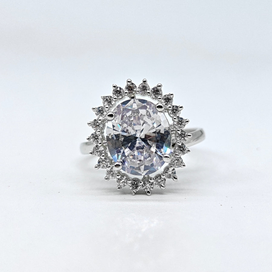 Silver-plated crystal halo adjustable ring with oval center stone and sparkling American diamond accents for women