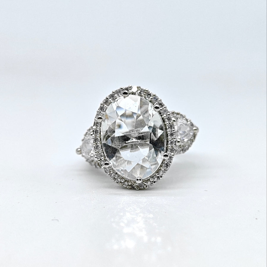 Silver-plated crystal majesty adjustable ring with oversized clear center stone and sparkling American diamond accents for women