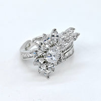 Diamond ring with leaf-like design on a white background