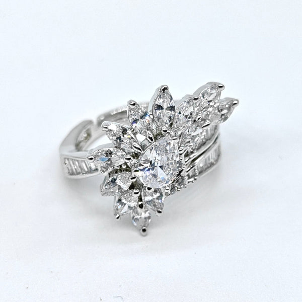 Diamond ring with leaf-like design on a white background