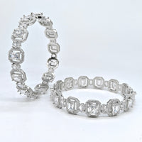 Two diamond eternity bands on a white background