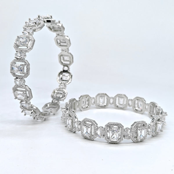 Two diamond eternity bands on a white background