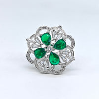 Silver-plated emerald petal bloom adjustable ring with green pear-cut stones and sparkling American diamond accents for women