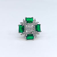 Silver-plated emerald royale frame ring with emerald-cut green stones and sparkling American diamond accents for women