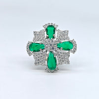 Silver-plated emerald starburst adjustable ring with green pear-cut stones and sparkling American diamond accents for women