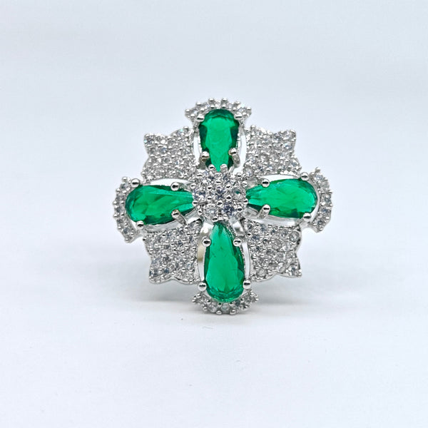Silver-plated emerald starburst adjustable ring with green pear-cut stones and sparkling American diamond accents for women