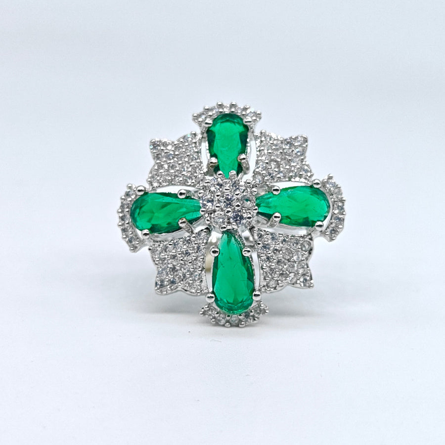 Silver-plated emerald starburst adjustable ring with green pear-cut stones and sparkling American diamond accents for women