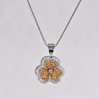 Floral pendant necklace on a light gray background
