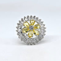 Jewelry item with yellow gemstones and silver accents on a white background