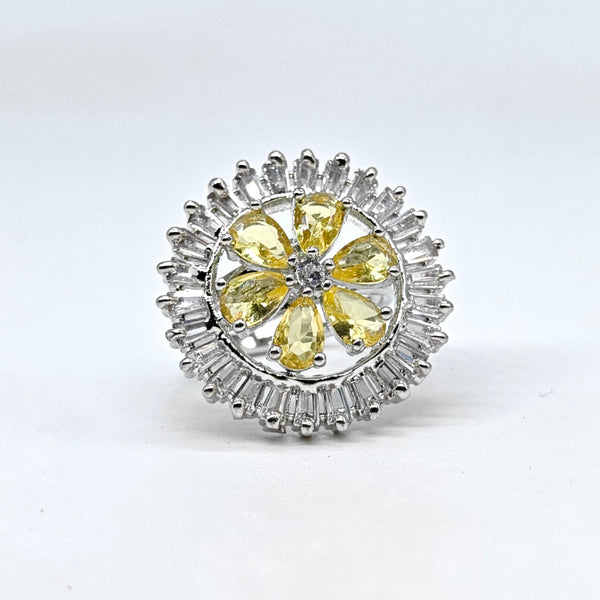 Jewelry item with yellow gemstones and silver accents on a white background