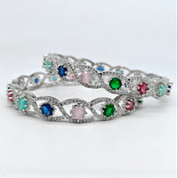 Silver bracelet with colorful gemstones on a white background