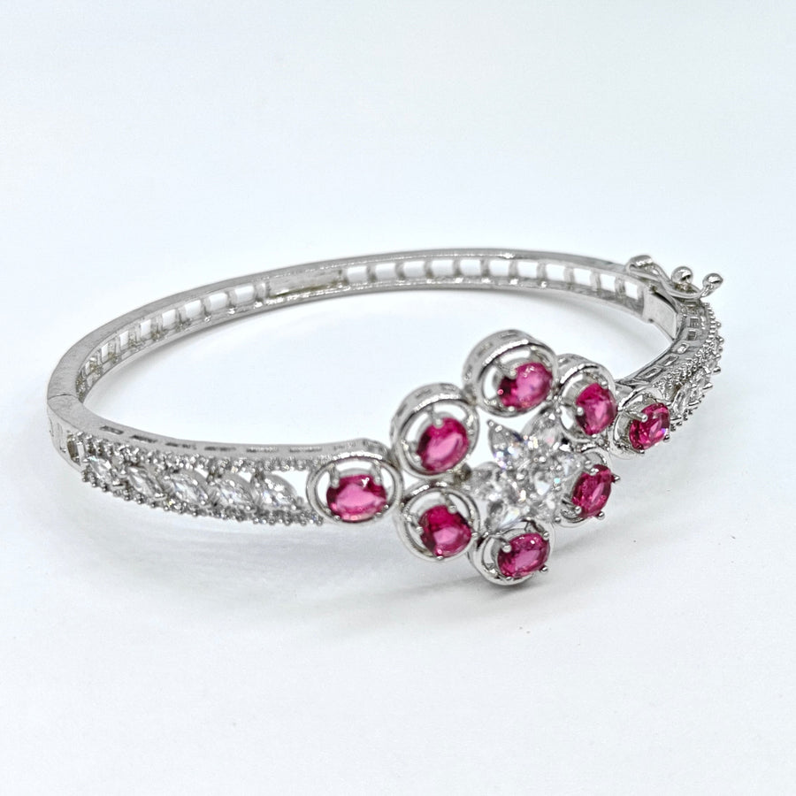 Silver-plated American diamond bracelet with ruby pink floral stones and sparkling crystal accents for women