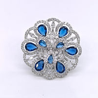 Silver-plated sapphire bloom adjustable ring with blue teardrop stones and sparkling crystal accents for women