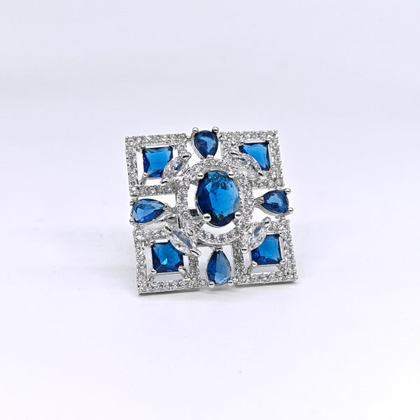 Silver ring with blue gemstones on a white background