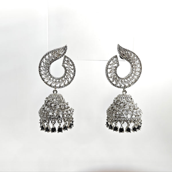Pair of silver earrings with intricate designs on a white background